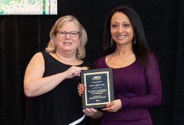 Dr. Sabina Malla (left) receives the 2020 "10 Under Ten" award from MDS President Dr. Shannon McCarthy (right)