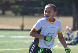 Youth athlete wearing a mouthguard